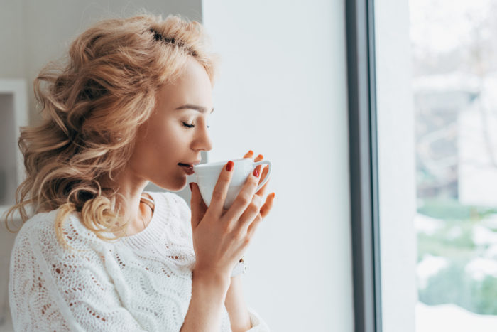 woman drinking grove square coffee