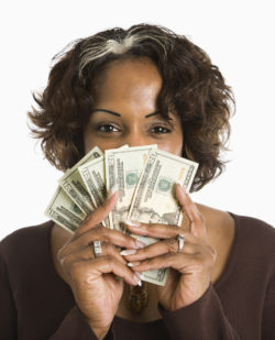 woman holding money from ftc refund