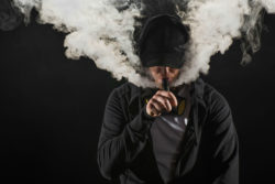 Young man vaping
