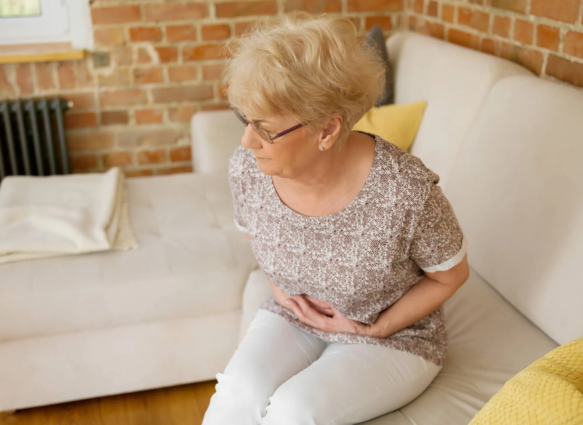 Senior woman having stomachache