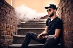 Vaper with beard in sunglasses