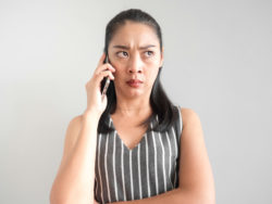 Annoyed woman on the phone