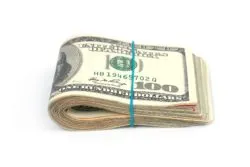 wad of cash used in debt settlement bait and switch