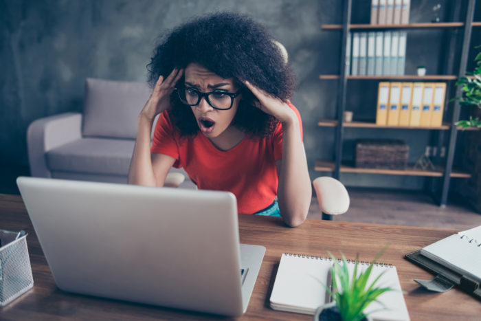 woman looking at website and deciding to file MyLife lawsuit
