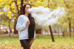 Girl smoking e-cigarette