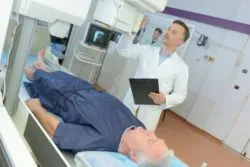 patient undergoing MRI with male doctor