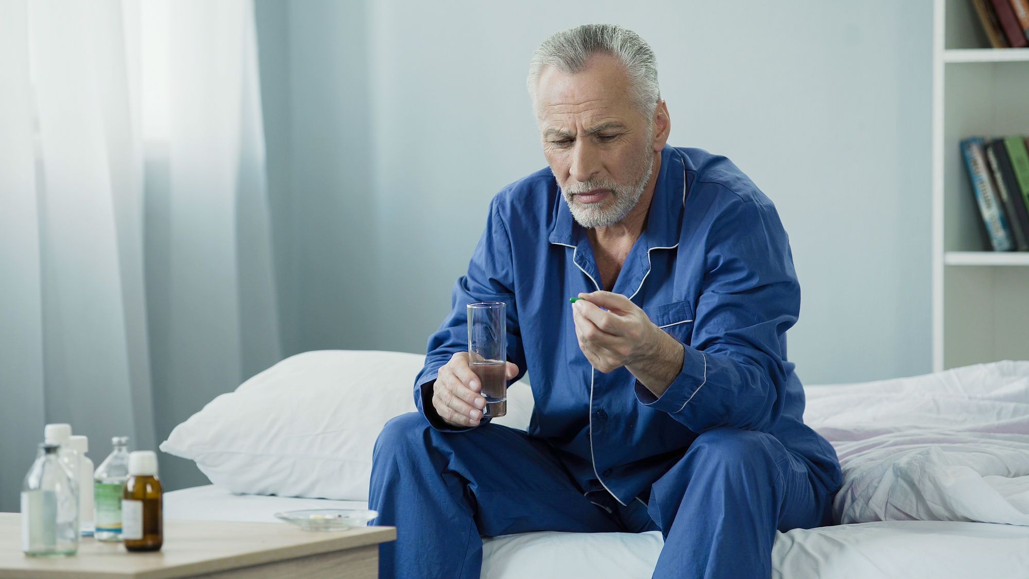 Older man taking medication