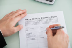A qualifying injury or illness entitles US citizens who have paid into the system to collect Social Security Disability payments.