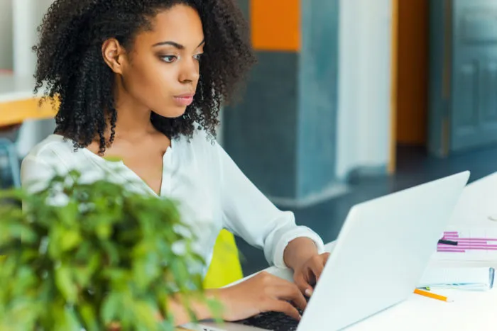 woman looking at Intelius website