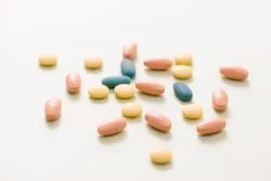 Tablets and capsules over white background