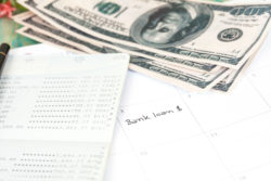 Bank loan in calendar with cash and a ledger
