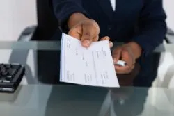 businessman holding check