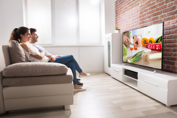 couple watching samsung plasma tv
