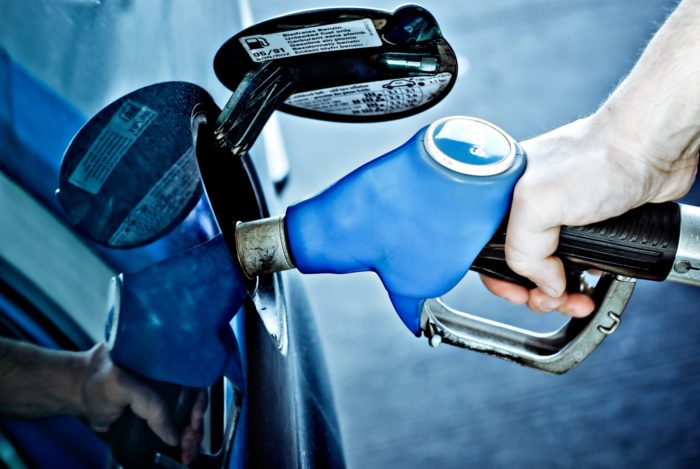 filling up ford vehicle at gas station