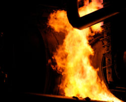 A fire burns around a pipeline.