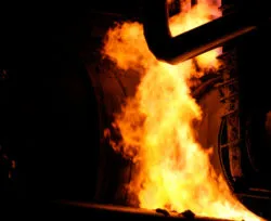 A fire burns around a pipeline.