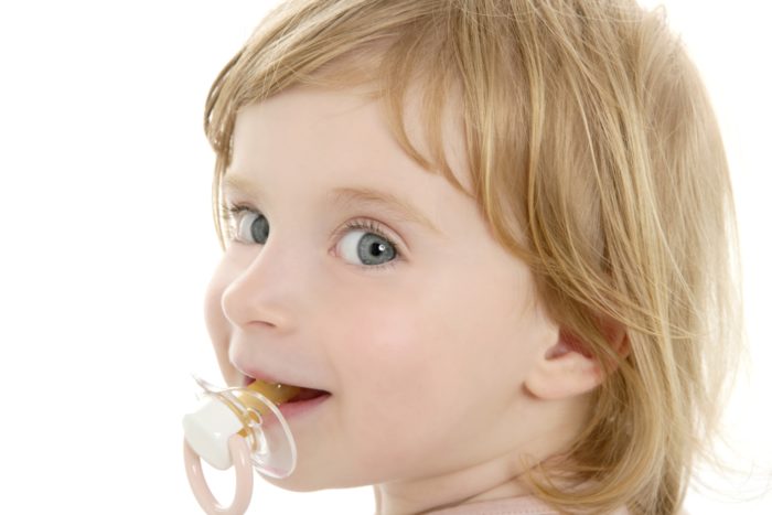toddler with NUK pacifier
