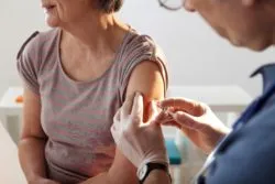 vaccinating an elderly person