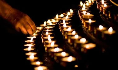 Lighting votive candles