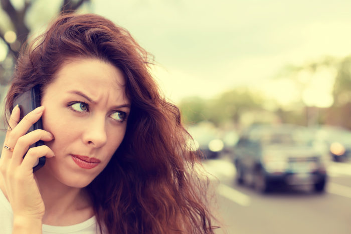 woman getting ringless voicemail from Oasis Energy