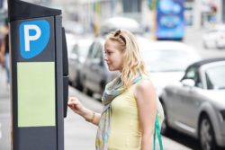 woman paying for Chicago meter parking