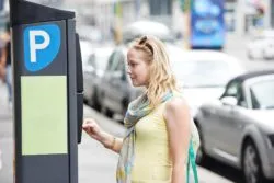 woman paying for Chicago meter parking