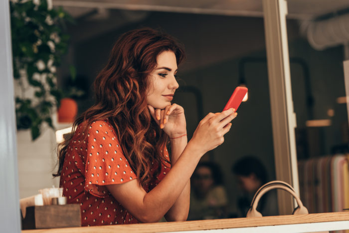 woman receiving unwanted text from SmartPay