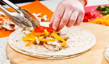 Worker making burrito