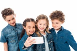children taking selfie