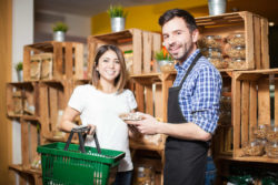 Clerk and customer at grocery store