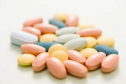 Colorful tablets on white background