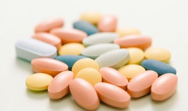 Colorful tablets on white background