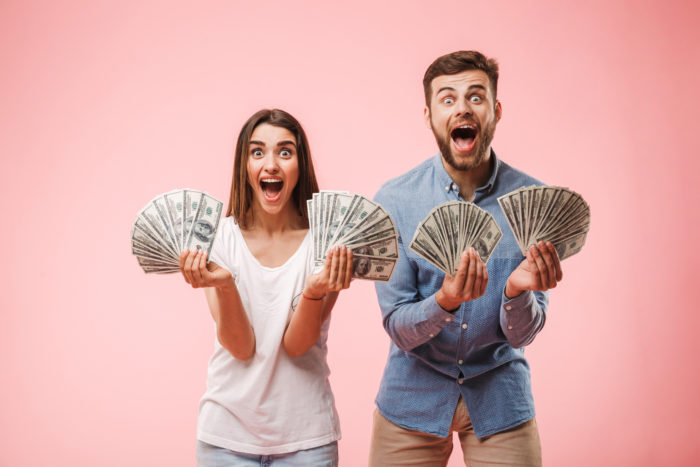 couple getting money from settlement checks