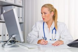 doctor-looking-at-computer-monitor