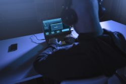hacker stealing info in a data breach