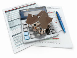 House, calculator, mortgage documents