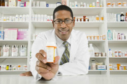 Pharmacist behind counter