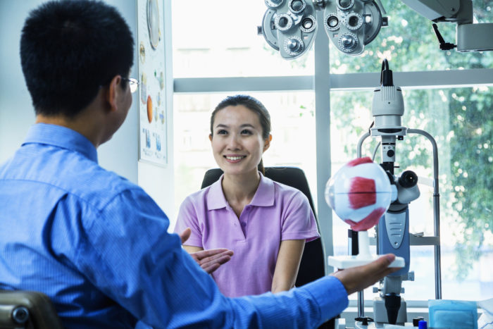 A woman gets an eye exam.