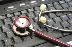 Stethoscope on computer keyboard