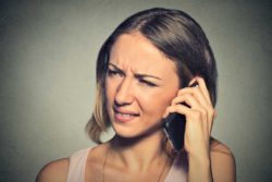 unhappy woman on cell phone