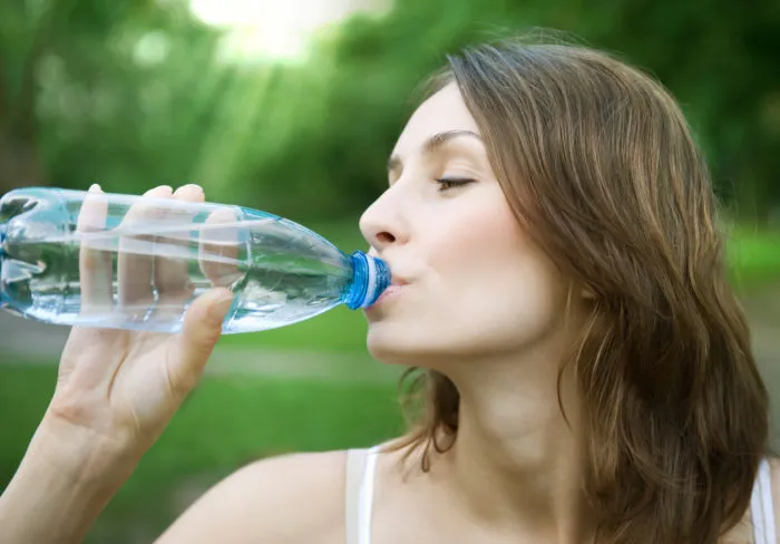 woman drinking penafiel bottled water