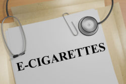 Word "e-cigarette" on file with stethoscope