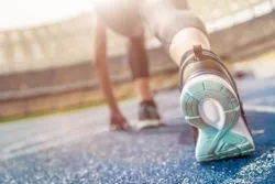Woman running with Road Runner sports membership