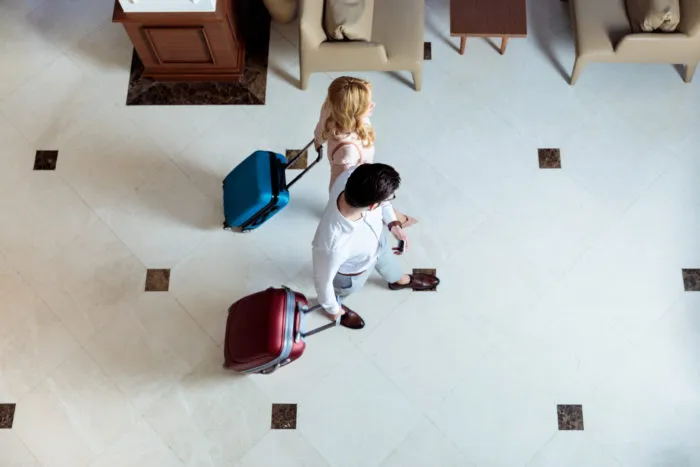 couple checking into wyndham hotel
