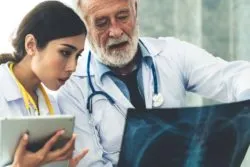Doctors looking at lung xray