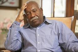 Man in nursing home sitting in chair
