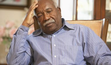 Man in nursing home sitting in chair