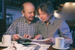 Older man and woman doing paperwork