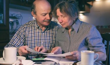 Older man and woman doing paperwork