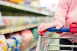 Woman pushing cart at big box store